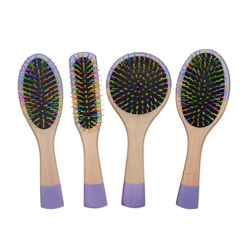 Brosse &agrave; coussin en bois peinte en violet avec des &eacute;pingles en nylon color&eacute;es